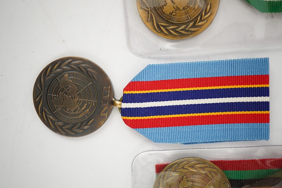 Thirteen United Nations (UN) and NATO medals, eleven UN examples with ‘ in the service of peace’ to the reverse, including a variety of ribbons for a number of different campaigns, (some duplicates), and two NATO ISAF Af